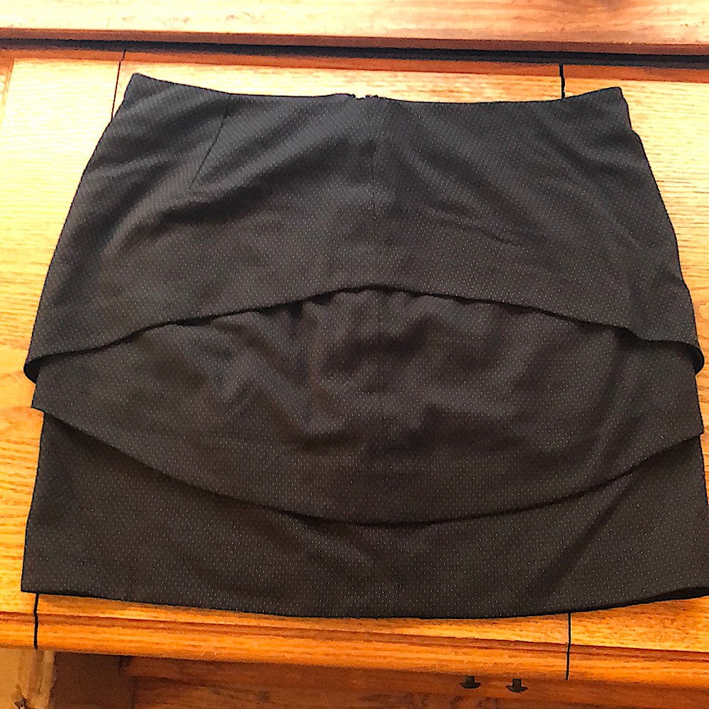 Black mini skirt with small polka dot accents.